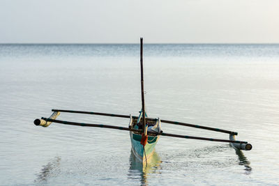 Nautical vessel in sea against sky