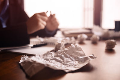 Close-up of human hand on table