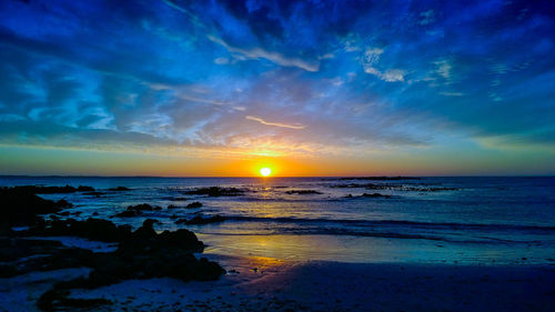 View of calm sea at sunset