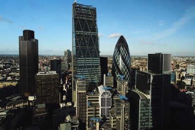 Modern buildings in city against sky