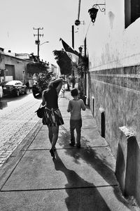 People walking on road in city