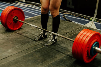Low section of man exercising in gym