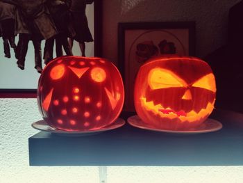 Close-up of illuminated pumpkin on table