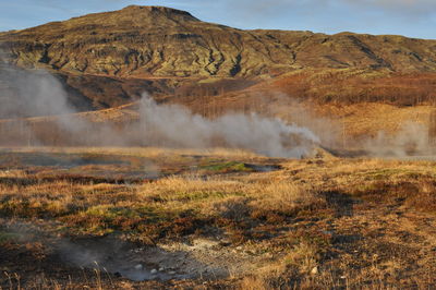 Smoke emitting from volcanic mountain