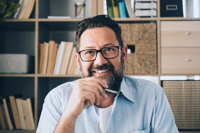 Portrait of man sitting at office