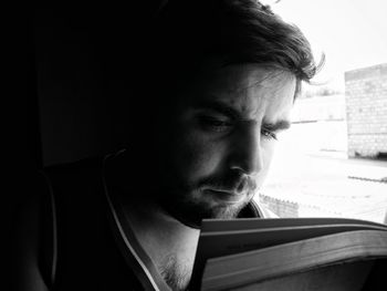 Close-up of man reading