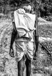 Rear view of man with umbrella