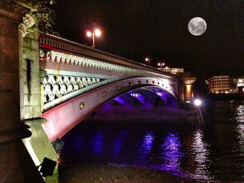 Bridge over river at night