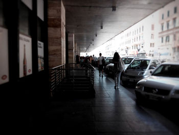 Woman standing by railing