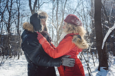 Woman with umbrella during winter