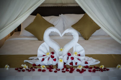 Close-up of heart shape on white table