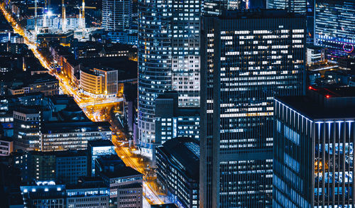 Illuminated modern buildings in city at night