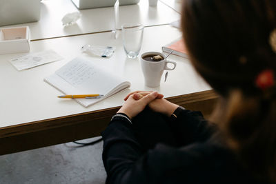 Close-up of woman working on table