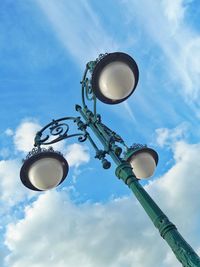 Low angle view of street light against sky