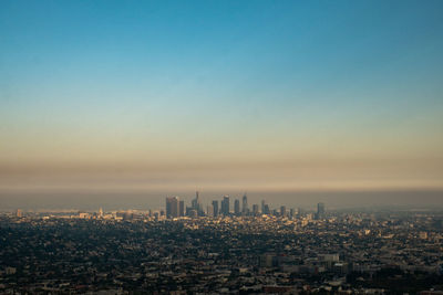 High angle view of buildings against sky during sunset