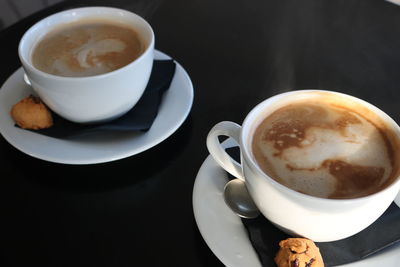 High angle view of coffee cup on table