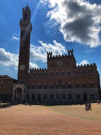 Historic building against cloudy sky