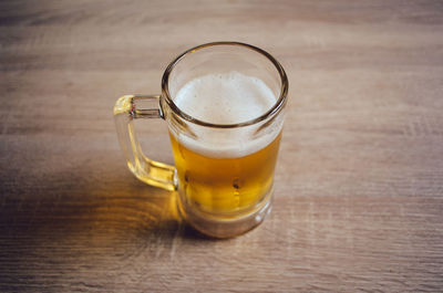 Close-up of beer glass on table