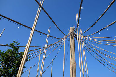 Low angle view of bridge against clear blue sky