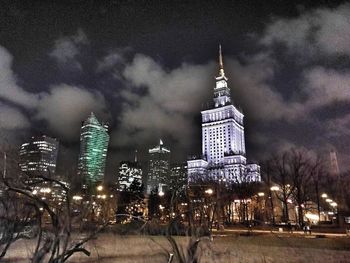 Low angle view of skyscrapers lit up at night