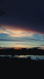 View of calm lake at sunset