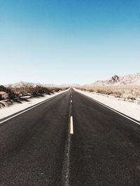 Road against clear sky