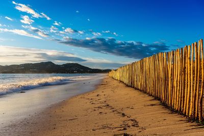 Scenic view of sea against blue sky