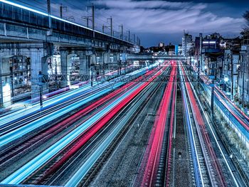 High angle view of light trails on rail road at night
