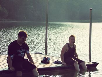 Portrait of young man sitting on bench
