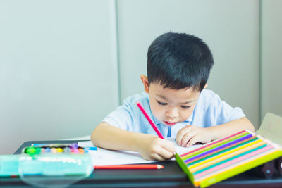 Boy drawing on paper