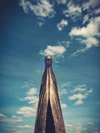 Low angle view of sculpture against blue sky