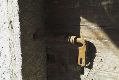 Close-up of metal door on wall