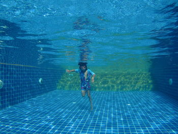 Man swimming in pool