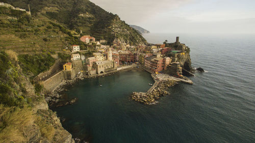 High angle view of buildings by sea