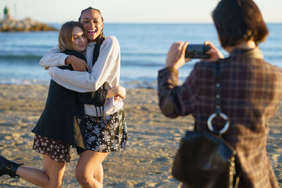 Happy friends enjoying at beach