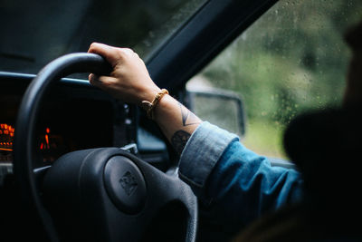 Close-up of hand holding car