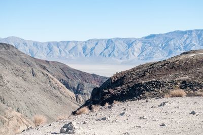 Scenic view of mountains against clear blue sky
