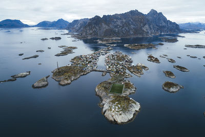 Soccer field on the cliffs of henningsvær by the sea