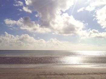 Scenic view of sea against cloudy sky