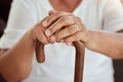 Midsection of woman holding hands