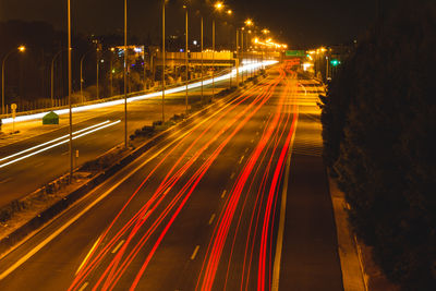 High angle view of light trails on road at night