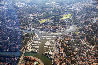 High angle view of illuminated city by river