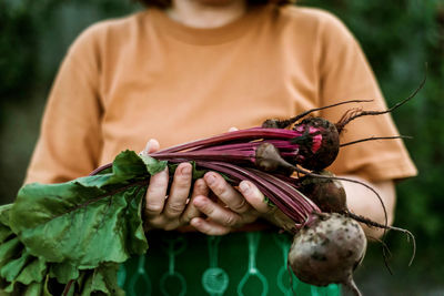 Midsection of woman holding food