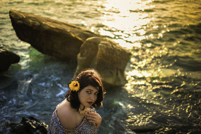 Portrait of young woman in sea