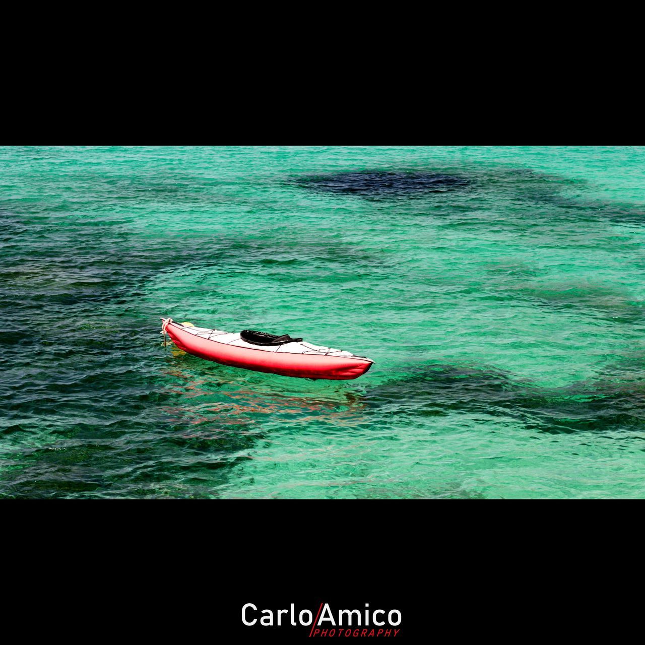 MAN IN BOAT ON SEA