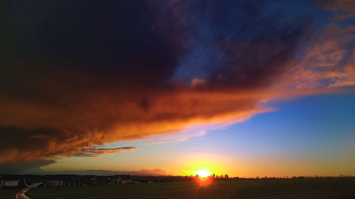 Scenic view of dramatic sky during sunset