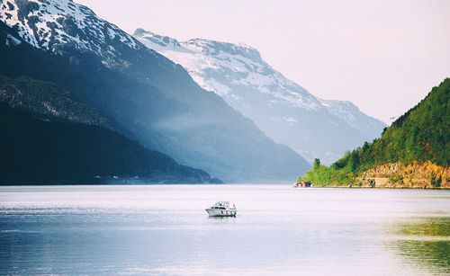 Scenic view of lake with mountains in background