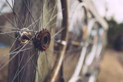 Close-up of bicycle wheels fence