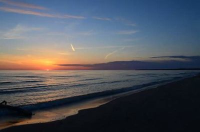 Scenic view of sea at sunset