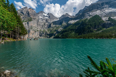 Scenic view of lake and mountains against sky